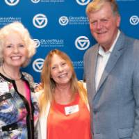 tom and marcia pose with woman